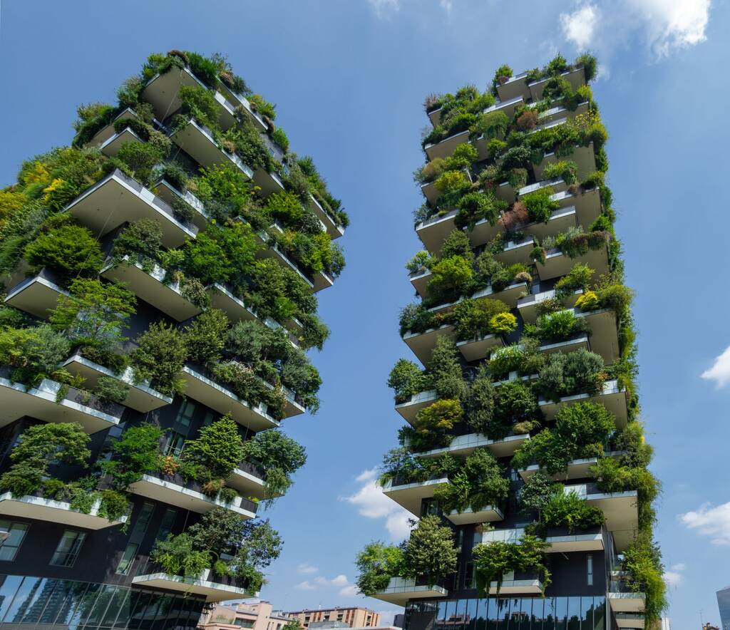 Milano, Italy. August 22, 2020. Bosco Verticale, view at the modern and ecological skyscraper with many trees on each balcony. Modern architecture, vertical gardens, terraces with plants